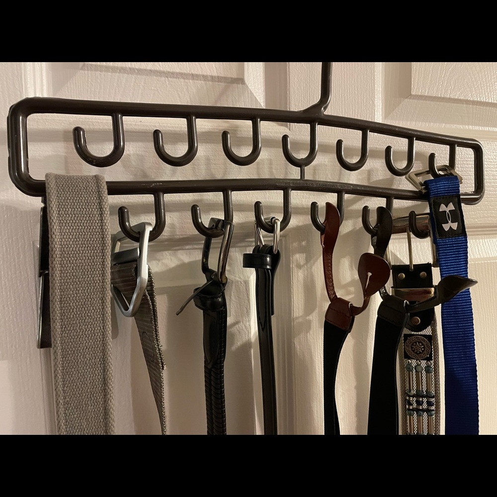 Lot of six belts, two suspenders and belt hanger.